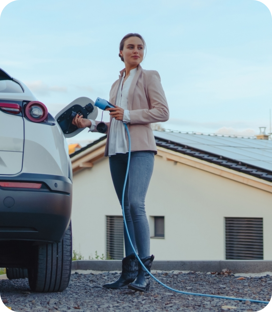 Woman Holding an Electric Vehicle Charger