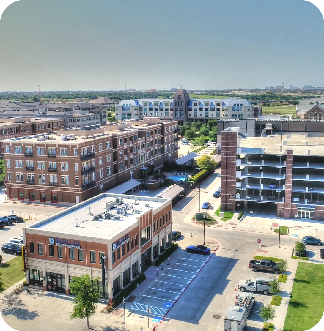 Aerial view of buildings and parking deck