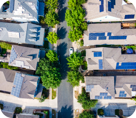 Birdseye view of a neighborhood with houses that have solar panels