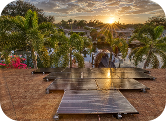 rooftop view from a home with solar panels looking out to the sunset