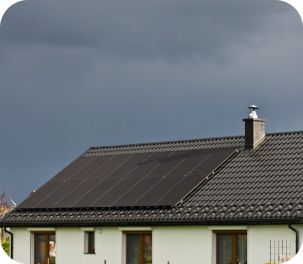 Cloudy skies and solar panels on roof