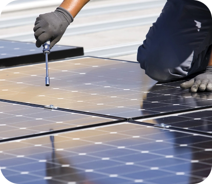 Solar technician installing solar panels on roof