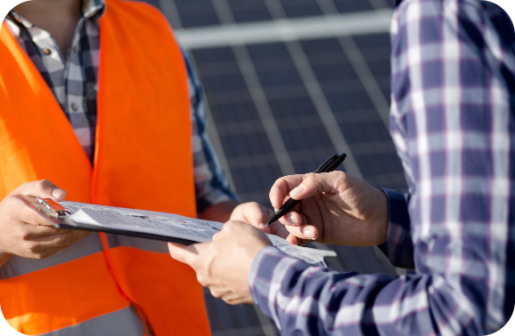 Solar panel technician holding a contract for a customer to sign