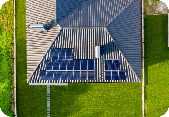 Birds eye view of a shingle roof with solar panels installed