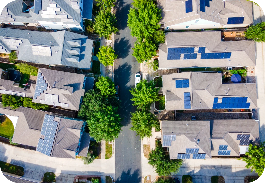 Neighborhood houses with solar panels view from a birdseye