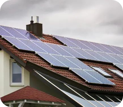 Solar panels on red tiled roof 