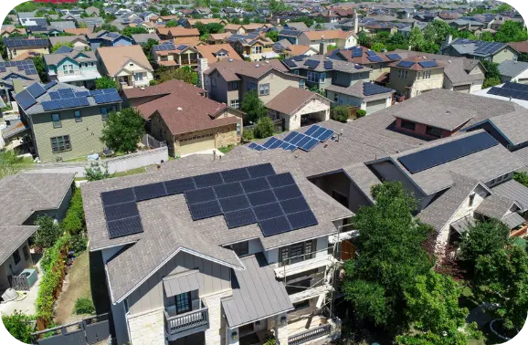 Aerial view of neighborhood with solar panels