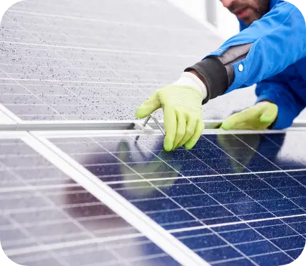 Worker wearing gloves installing panels