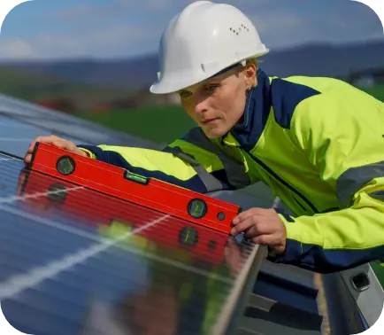 Worker leveling solar panels 