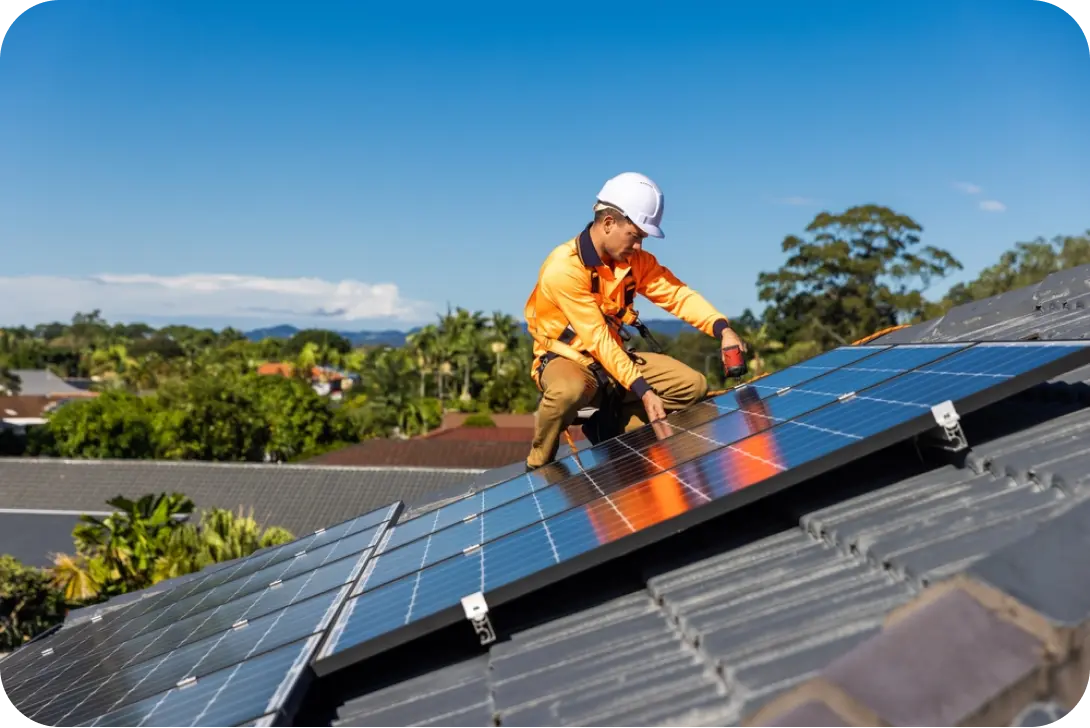 Worker in orange installing panels